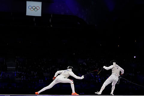 Italy and Japan fencers competes men's team foil final 